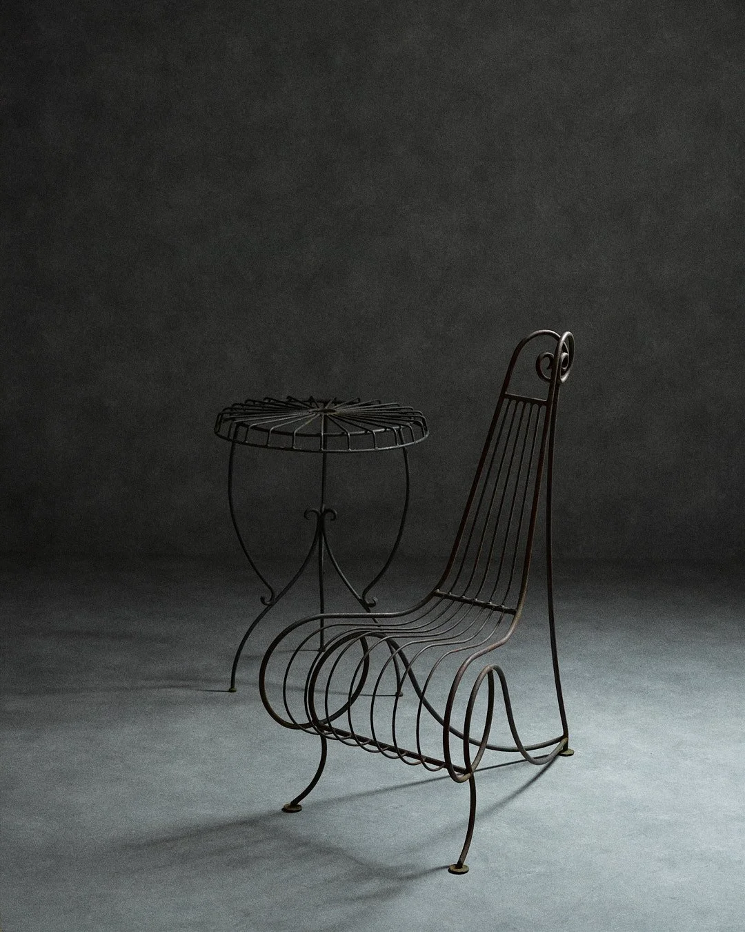 spine chair and table in the style of André Dubreuil.