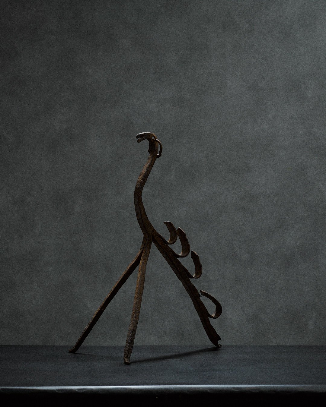 artisanal iron sculpture with animalistic features