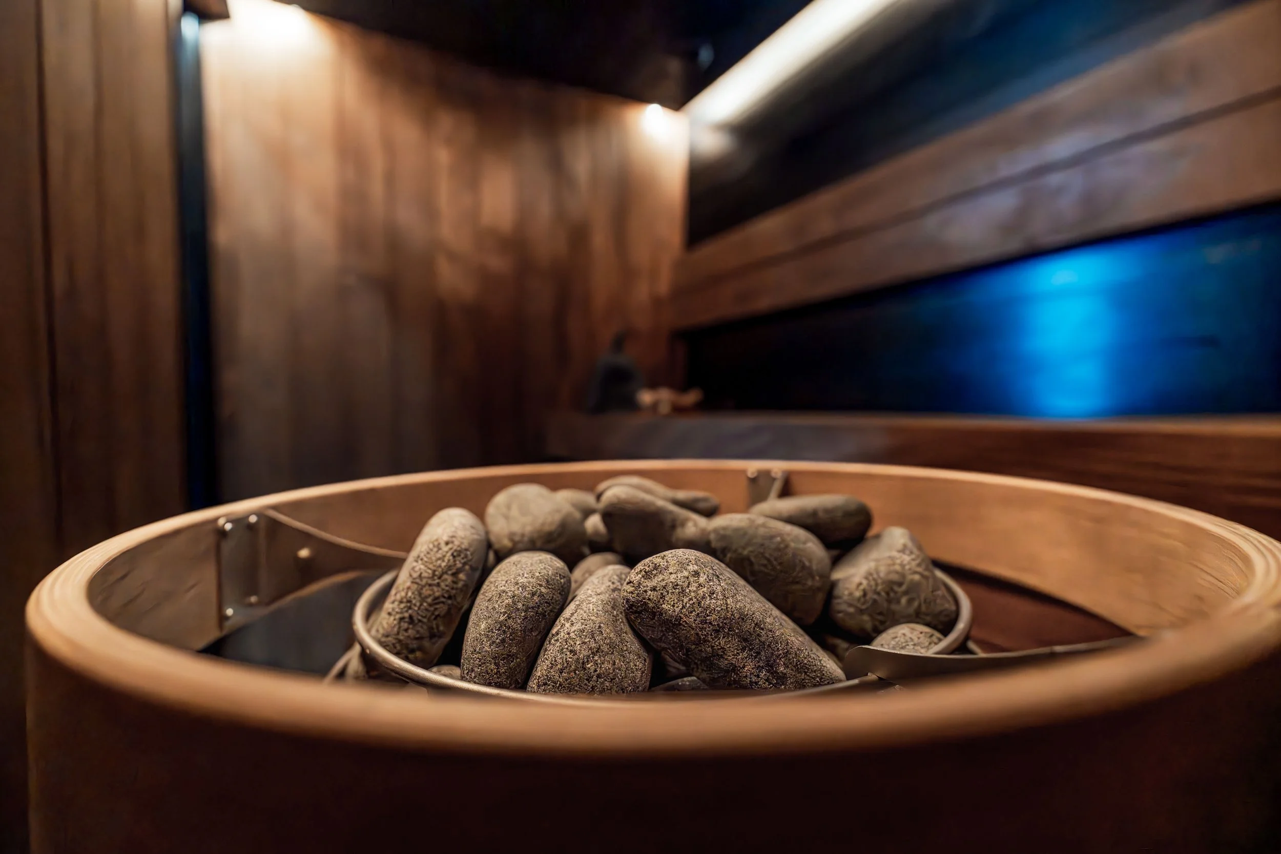 this is a traditional finnish sauna, with hot rocks on a stove in the forefront