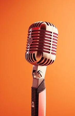 Vintage microphone on an orange background
