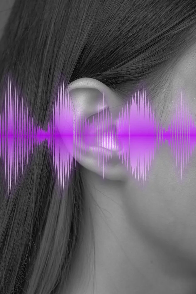 human ear with sound waves