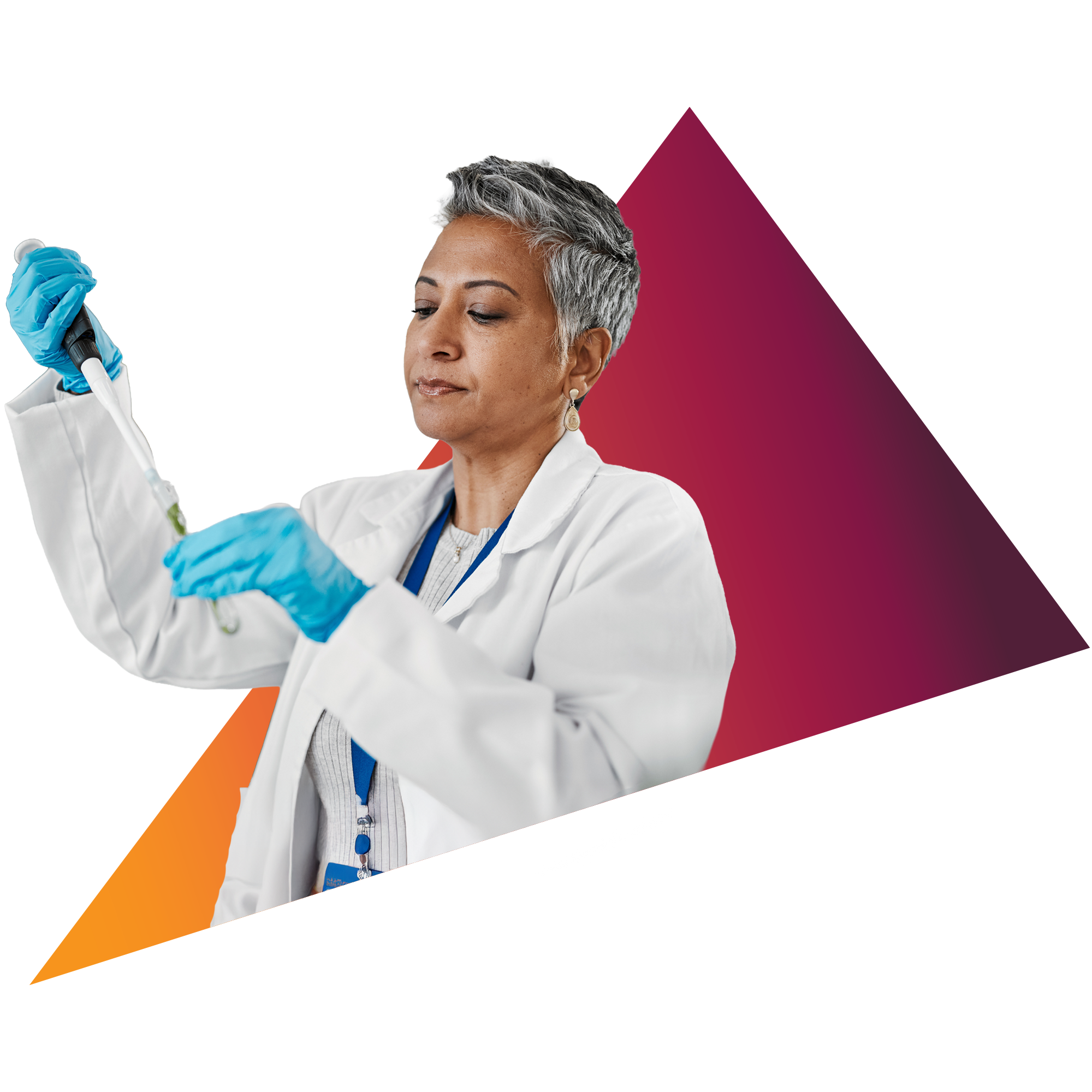 A female scientist with short gray hair wearing a white lab coat and blue gloves examines a test tube in a laboratory setting.