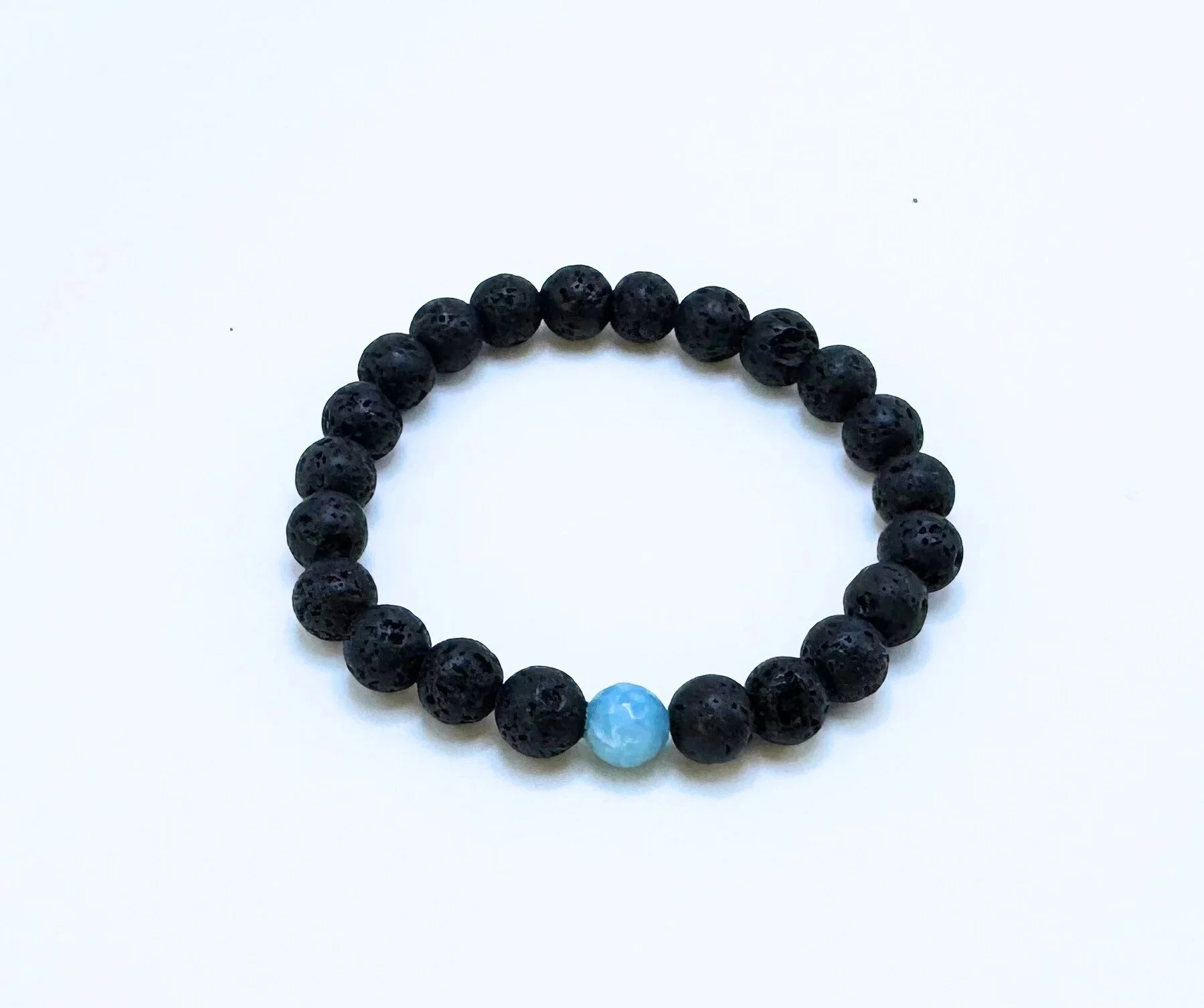 lava+stone+with+faceted+aquamarine.jpg
