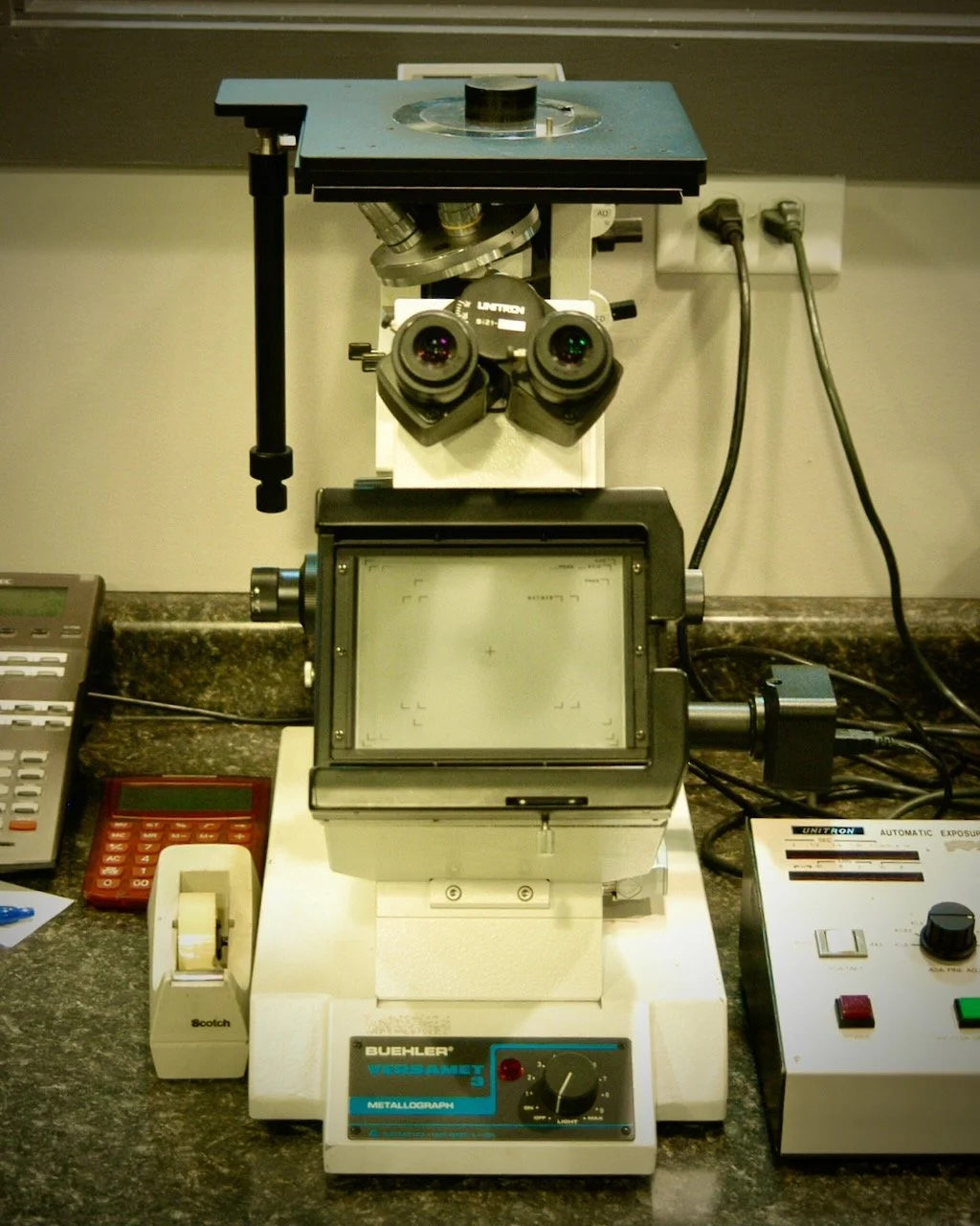 An industrial microscope on a work counter