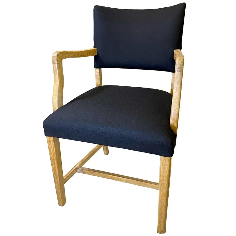 Small oak dining chair.
Of sentimental value, this small chair had repairs to the frame and all new upholstery to the seat and back before covering in a black wool from Warwick Fabrics.