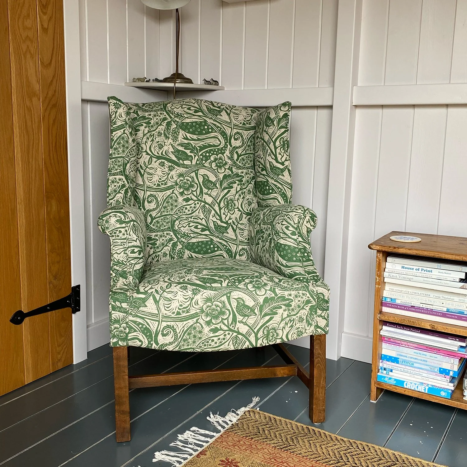 Edwardian wingback armchair finished in Mark Heard wren pattern fabric