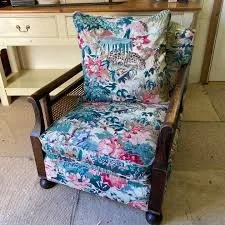 Armchair recovered in Linwood fabric