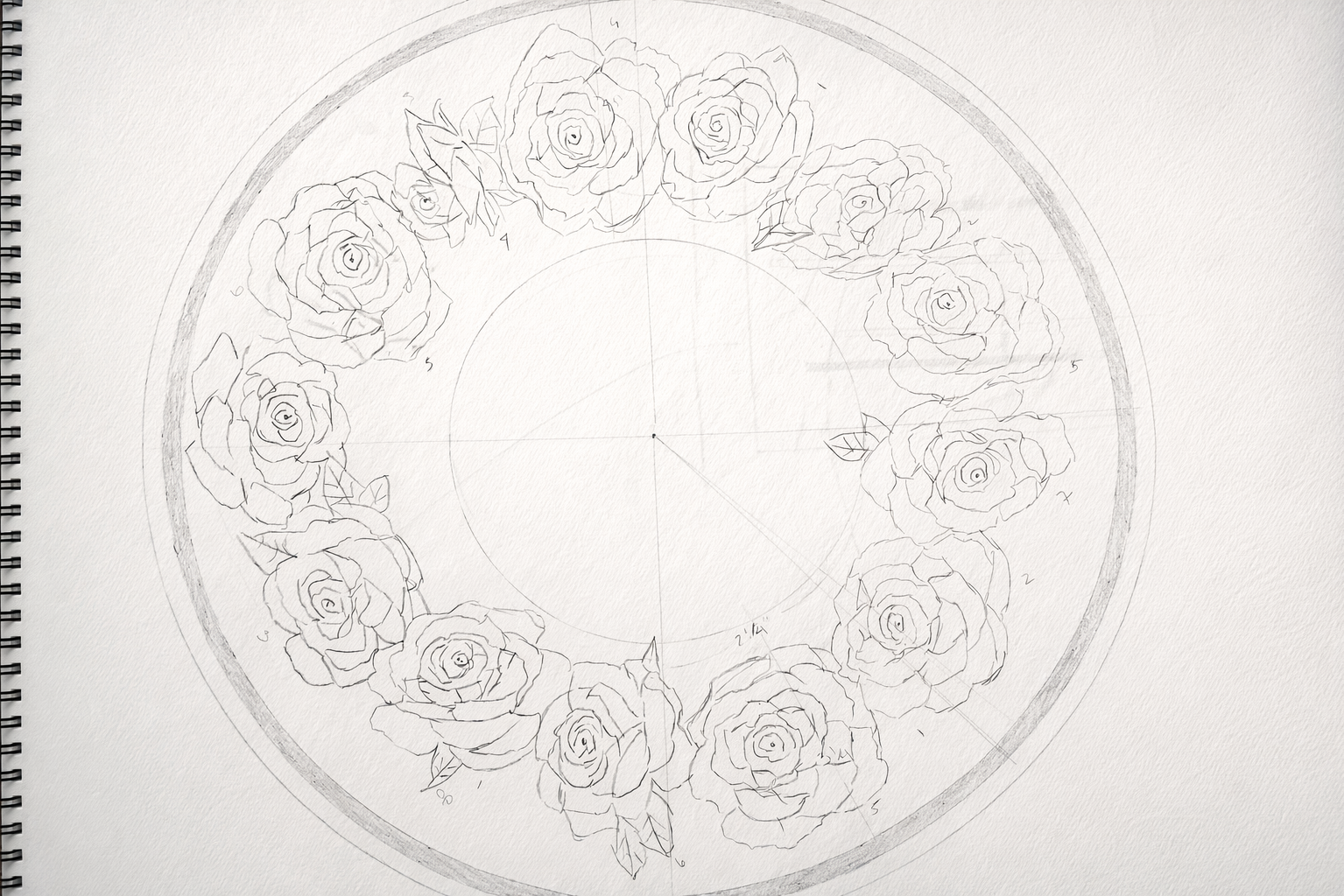 A sketch of a circular floral design featuring roses arranged around the circumference, with radiating lines and measurements for a detailed drawing or pattern.