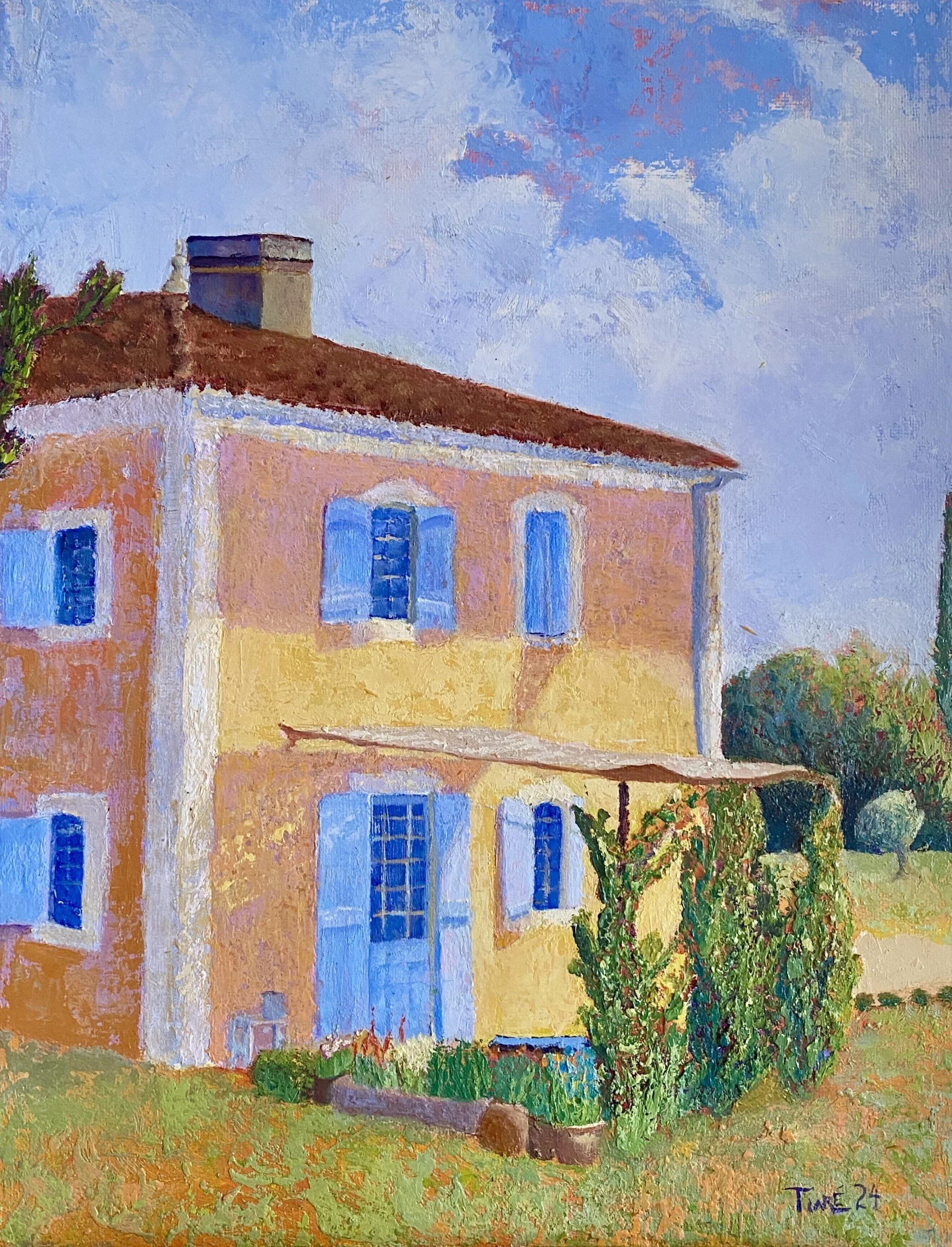 A colorful impressionist oil painting of a French style house with a reddish-orange roof, light yellow walls, and blue windows, surrounded by green bushes and trees, with a partly cloudy sky in the background.