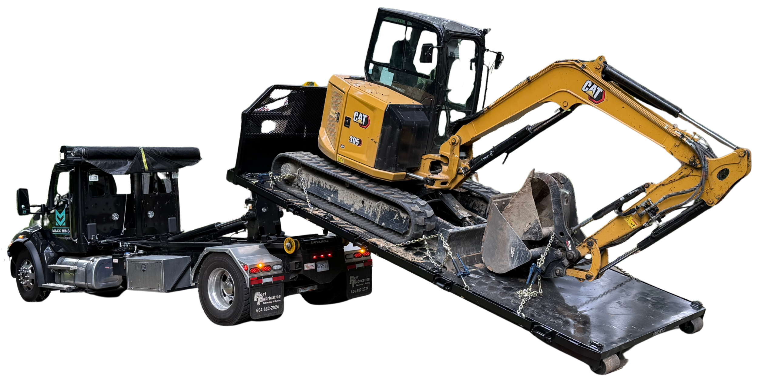 hooklift truck picking up an excavator on a flat deck
