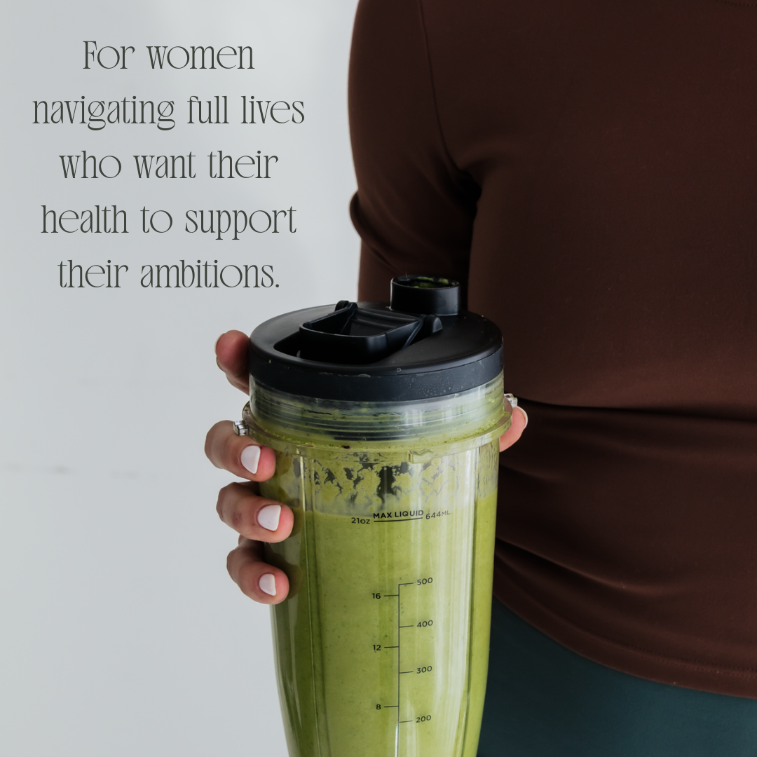 A person holding a green smoothie in a clear blender bottle. The person is wearing a brown shirt, and the background is plain. Text on the left side of the image reads: 'For women navigating full lives who want their health to support their ambitions