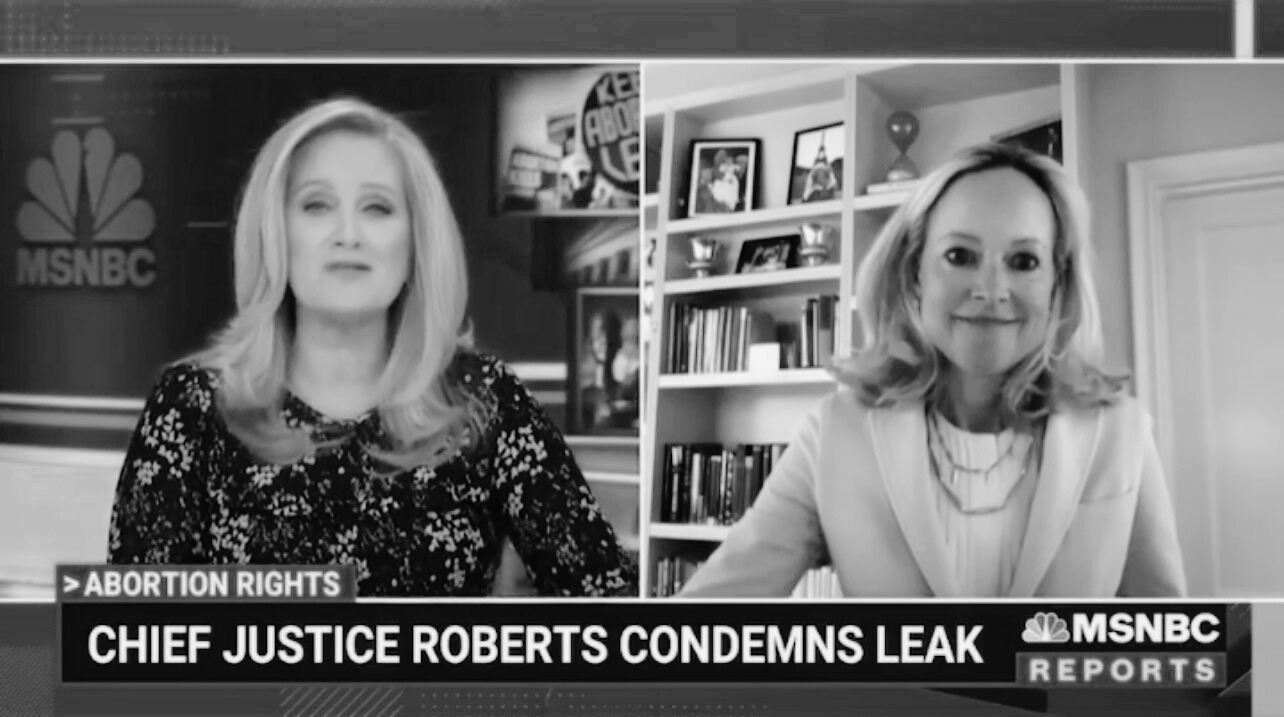 Black and white screenshot of two women in a television interview, with news ticker reading "Chief Justice Roberts Condemns Leak" on MSNBC.