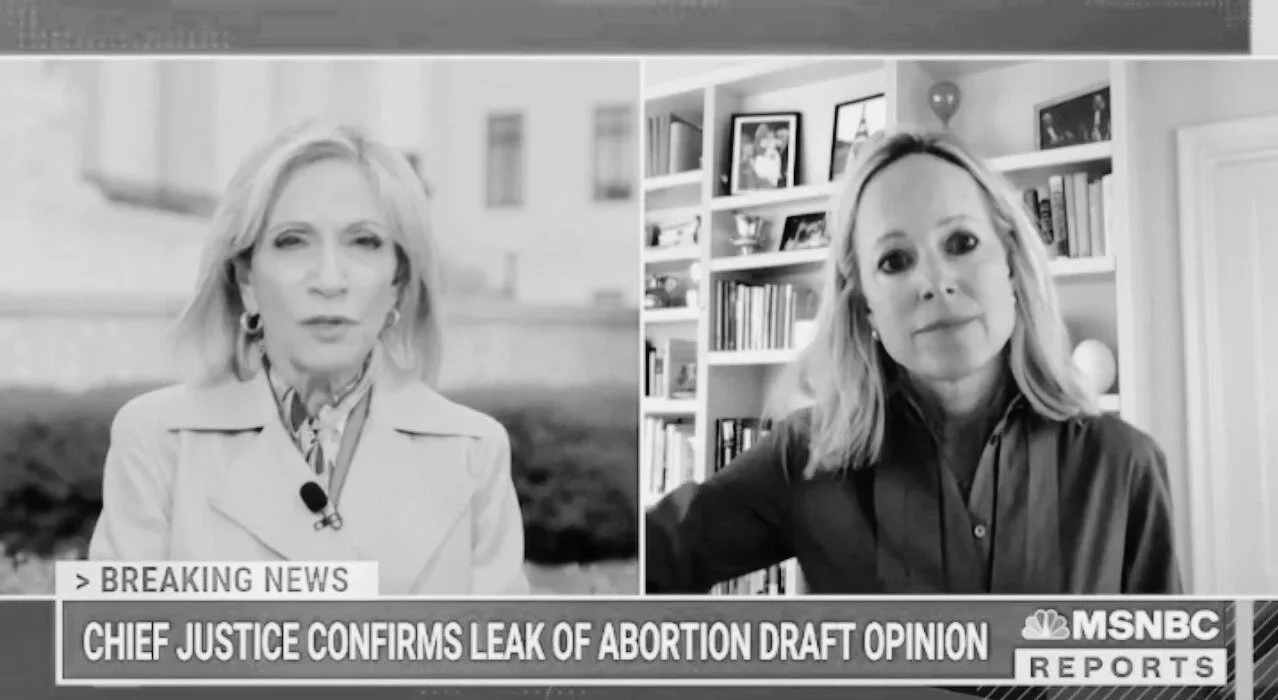 Black and white split-screen image showing a woman on the left speaking, and another woman on the right listening, with a news headline about a leak of an abortion draft opinion on MSNBC.