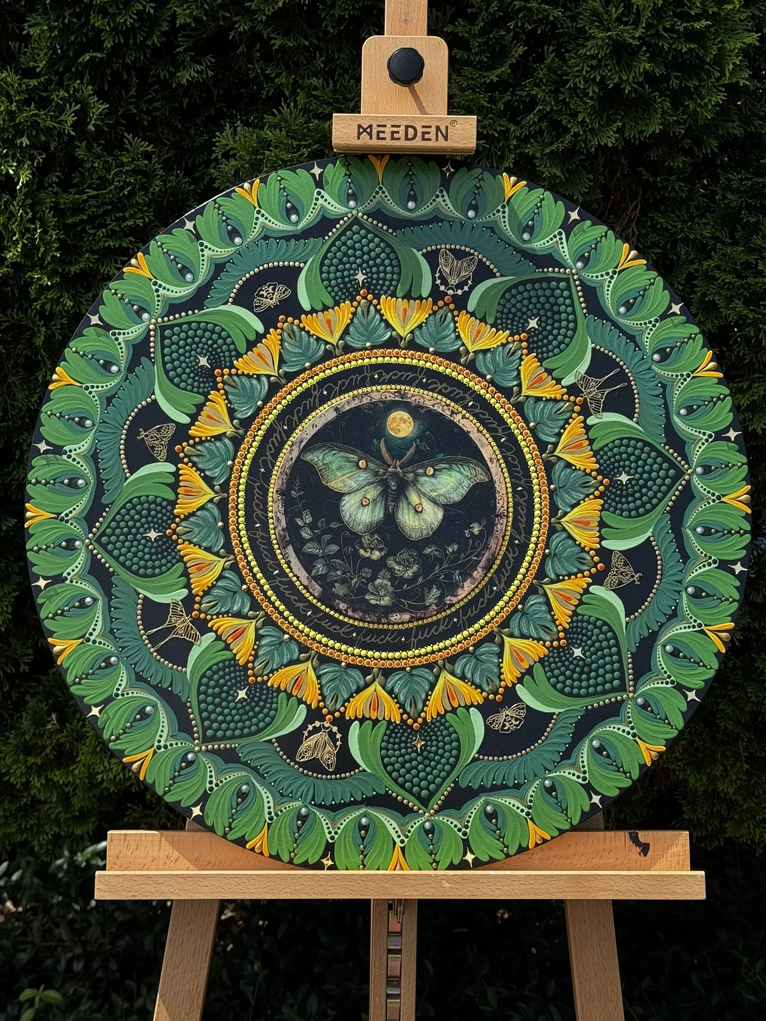 large green and yellow mandala with a luna moth insert gold star mirrors and gold moth embellishments