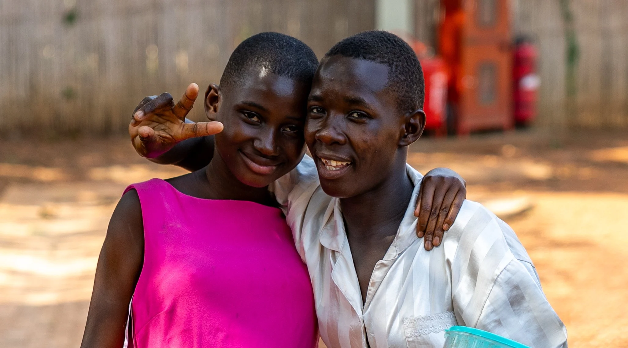Siblings’ joyful embrace