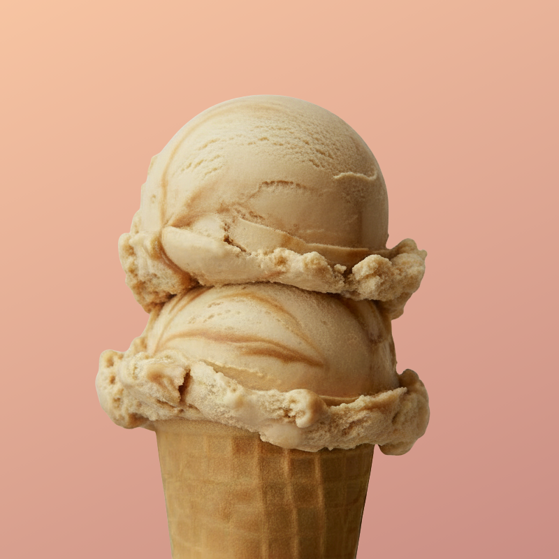 Two scoops of vanilla ice cream in a waffle cone against a pink background.
