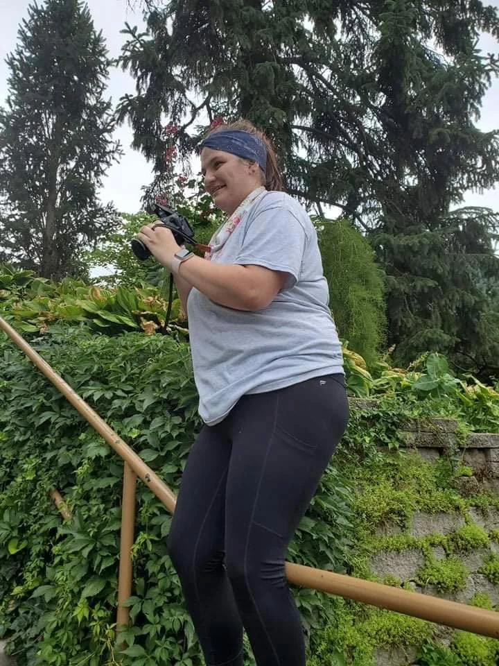 Proof that photographers will twist, crouch, lean, and do all kinds of awkward things just to get the shot. Grass stains, weird angles, and a whole lot of focus, all while chasing the moments that matter most. It may not always look glamorous behind 