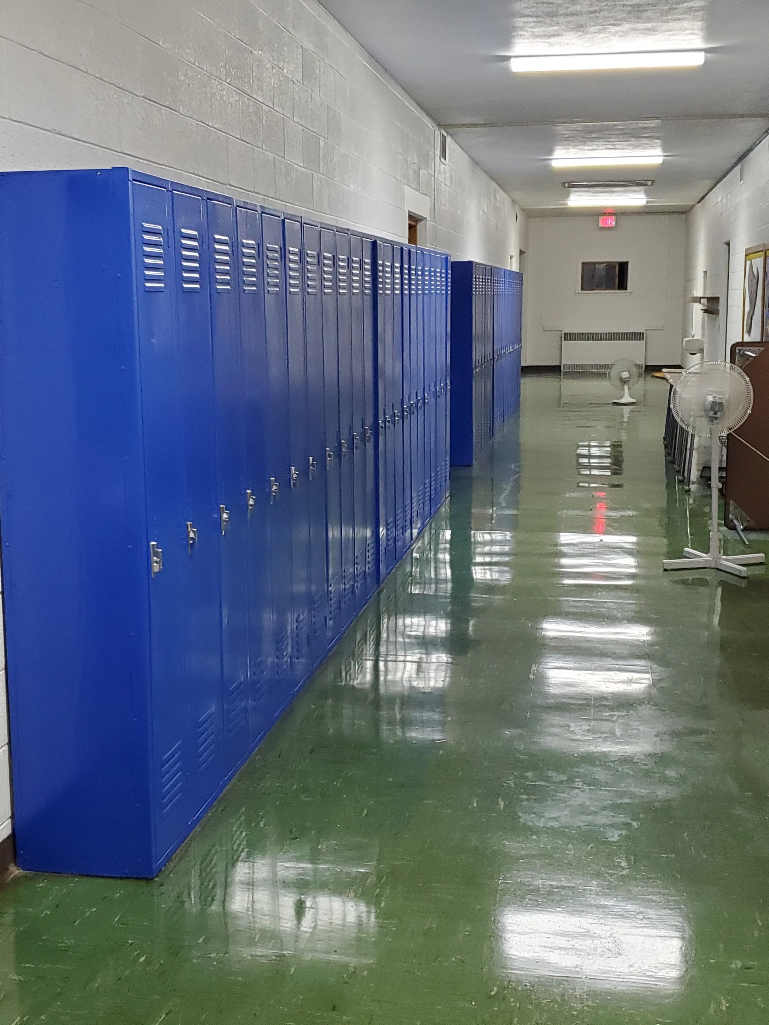 Painting of lockers at Our Lady of Sorrows school in Ladysmith Wisconsin