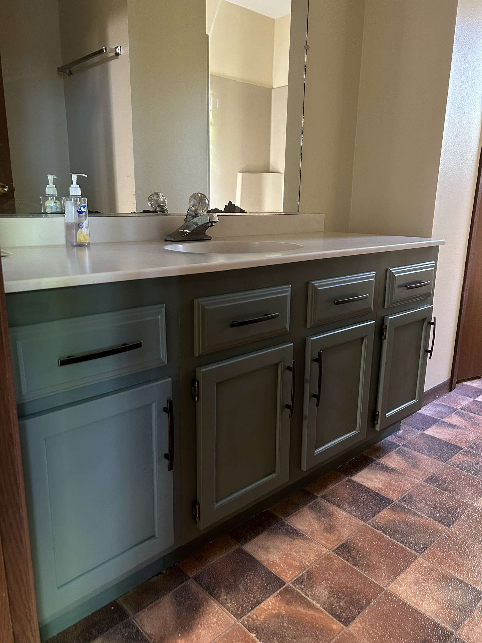 Green bathroom vanity painted in New Auburn Wisconsin in Chippewa County