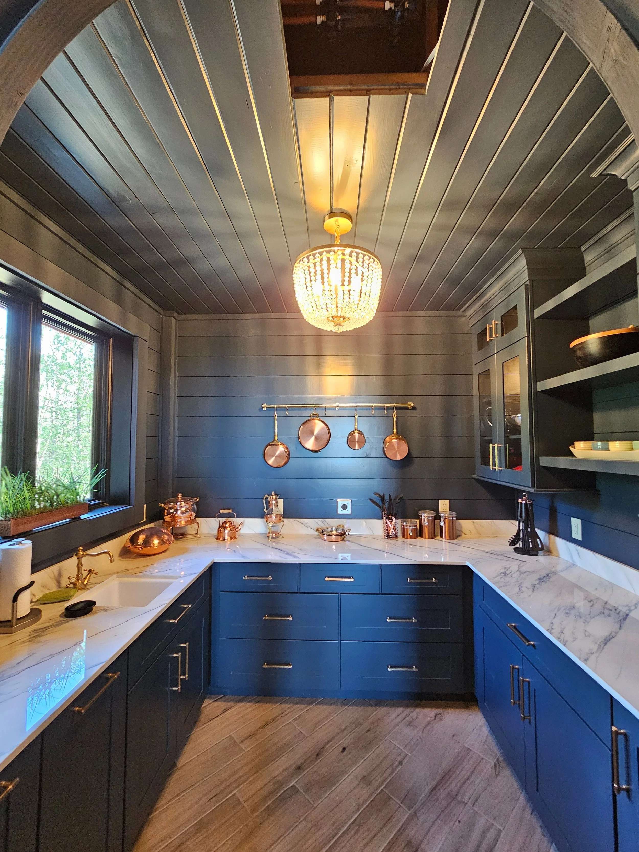 Heritage inspired new construction home using deep blues as the main color with gold and bronze accents in Price County Wisconsin