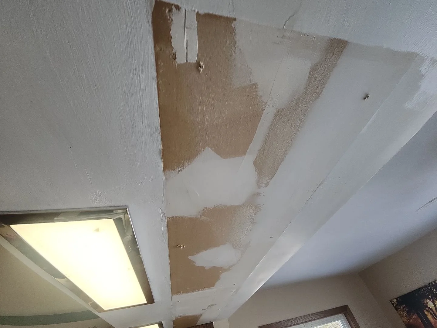 Ceiling drywall repairs where existing cabintry was removed in Rusk County Wisconsin