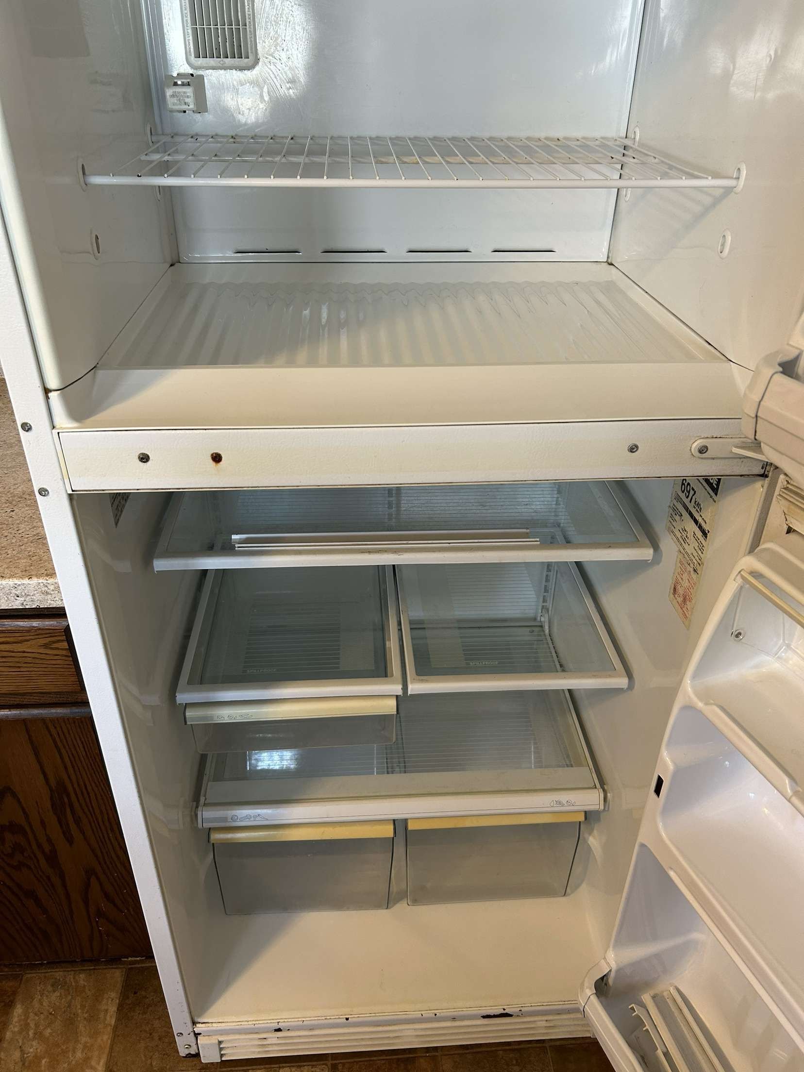 Inside of refrigerator after deep cleaning by Barefoot Painter LLC