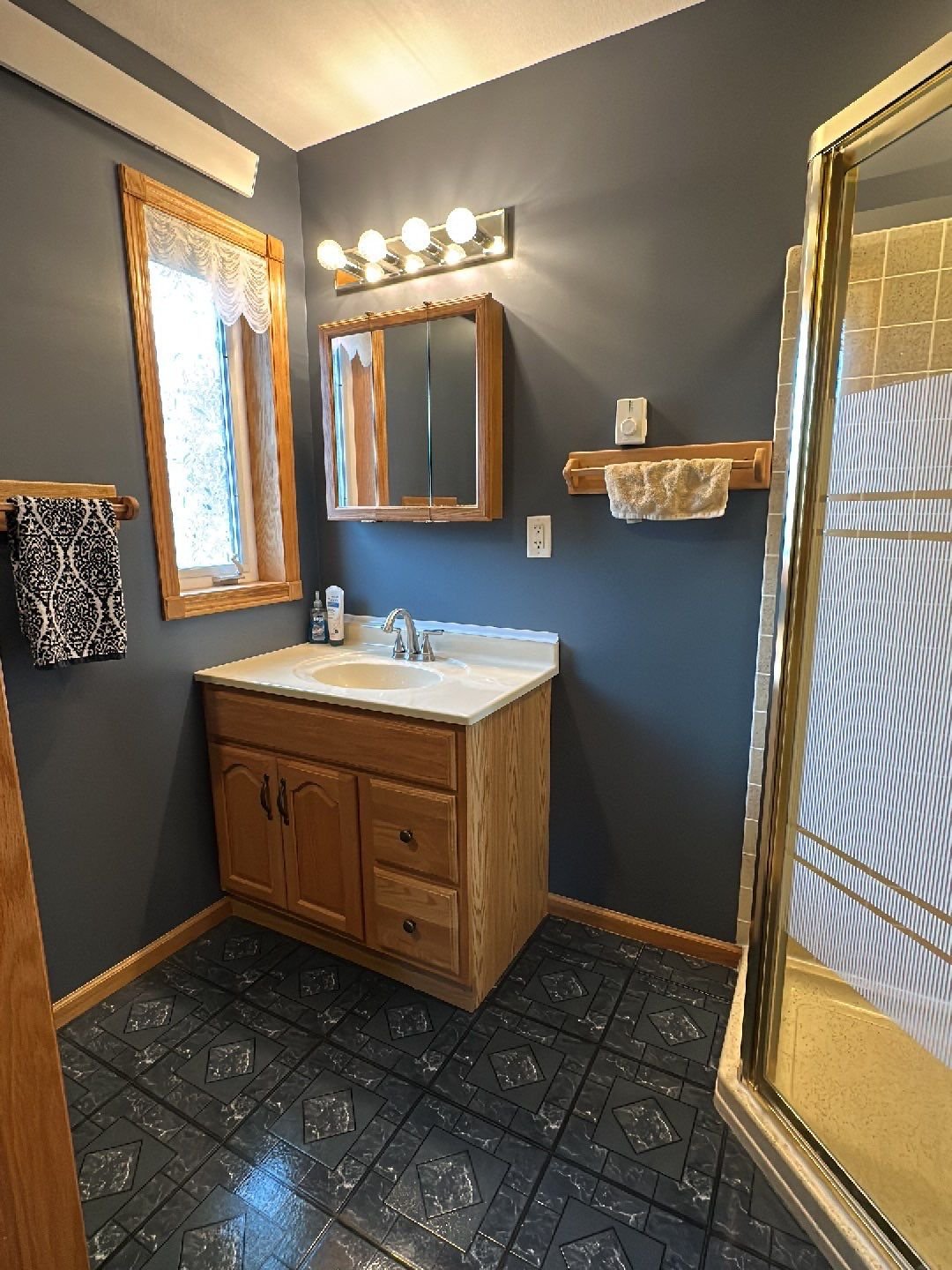 Deep blue tone gives very sophisticated feel to this northern Wisconsin bathroom