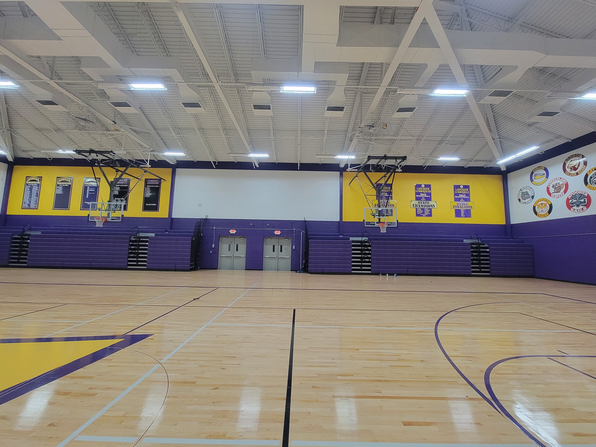 Ladysmith High School gymnasium painting white purple and gold