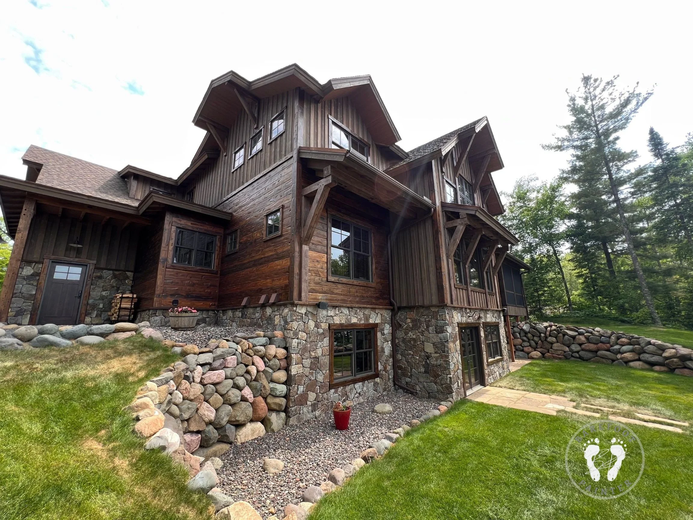 Multi-tone stained home in Hayward Wisconsin using satin and matte finishes