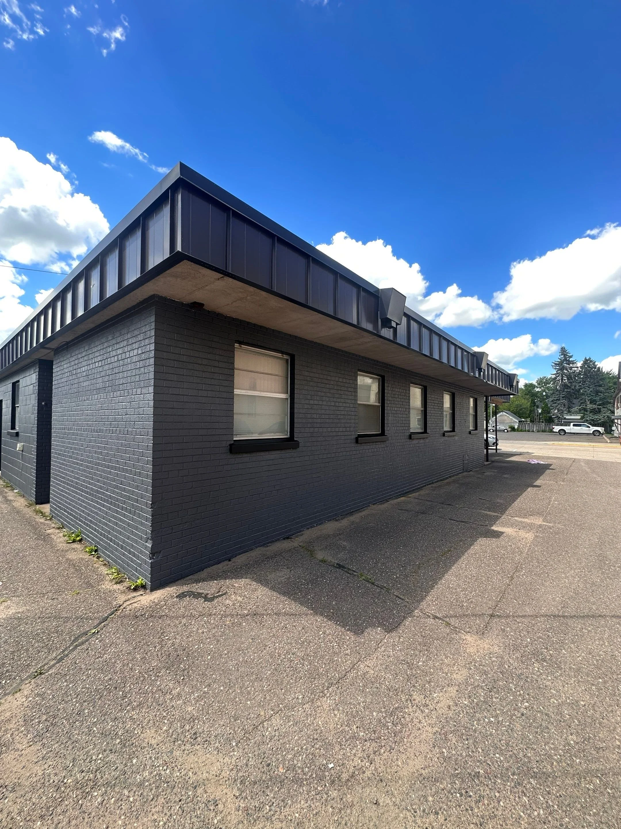 Law office exterior in Rice Lake Wisconsin brick painting with Sherwin Williams Loxon XP