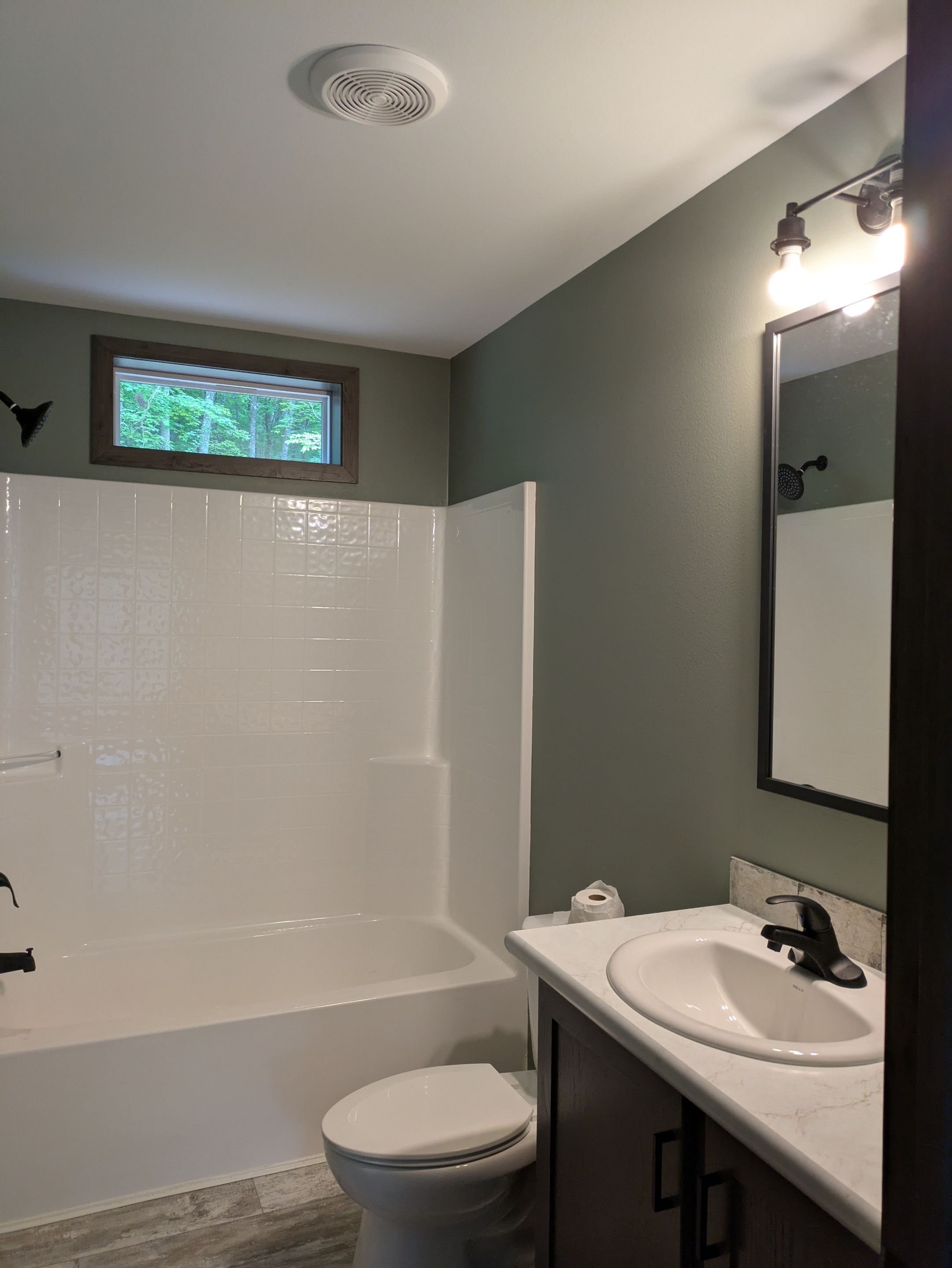 Sherwin Williams Evergreen Fog color in a new construction home bathroom in Northern Wisconsin - Sawyer County