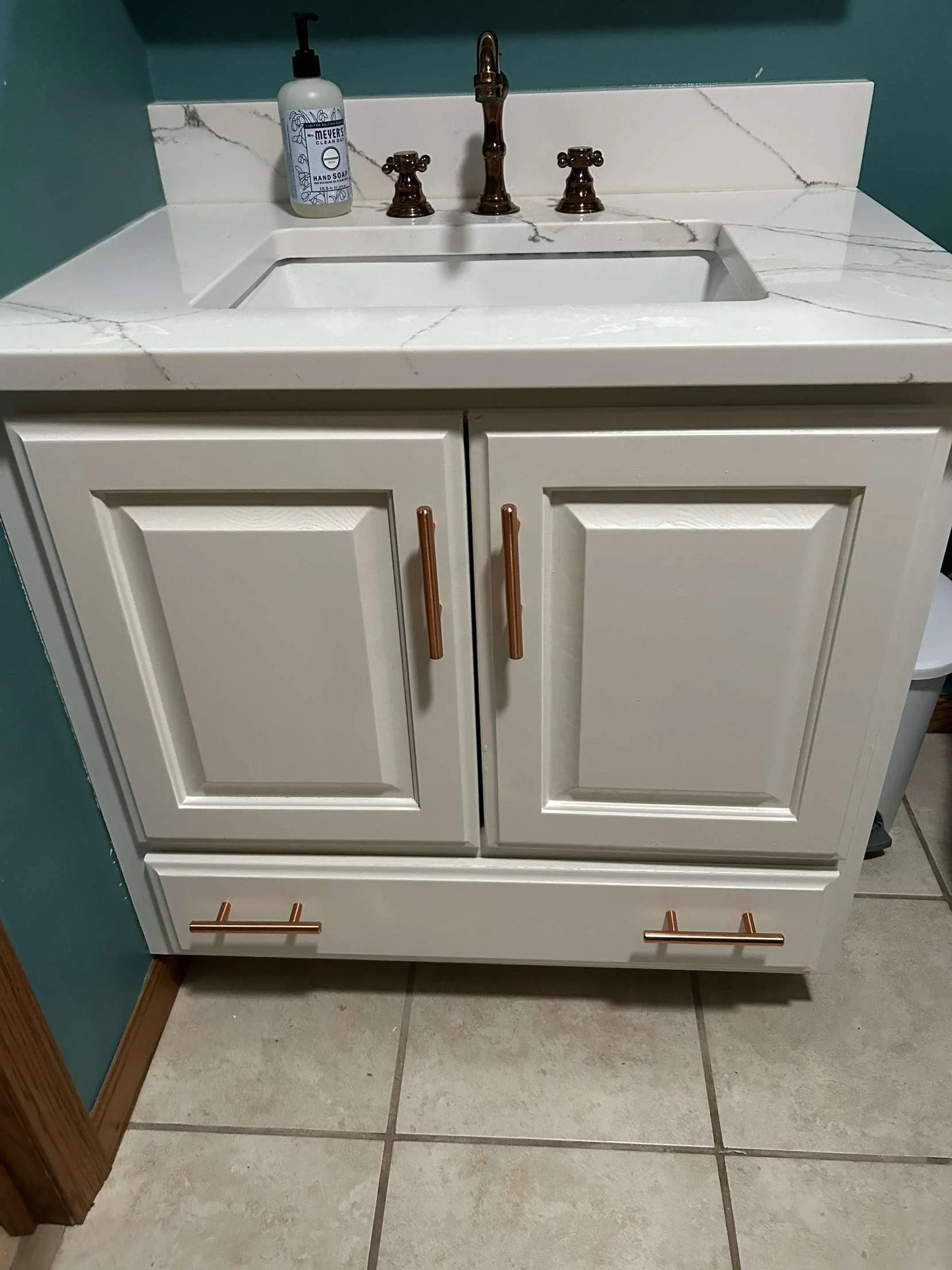 White professional painted bathroom vanity with gold hardware