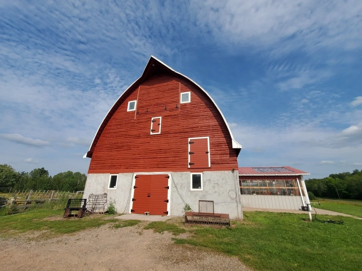 Barn painting in Rusk County, Wisconsin by professional paint company Barefoot Painter LLC in farm county 