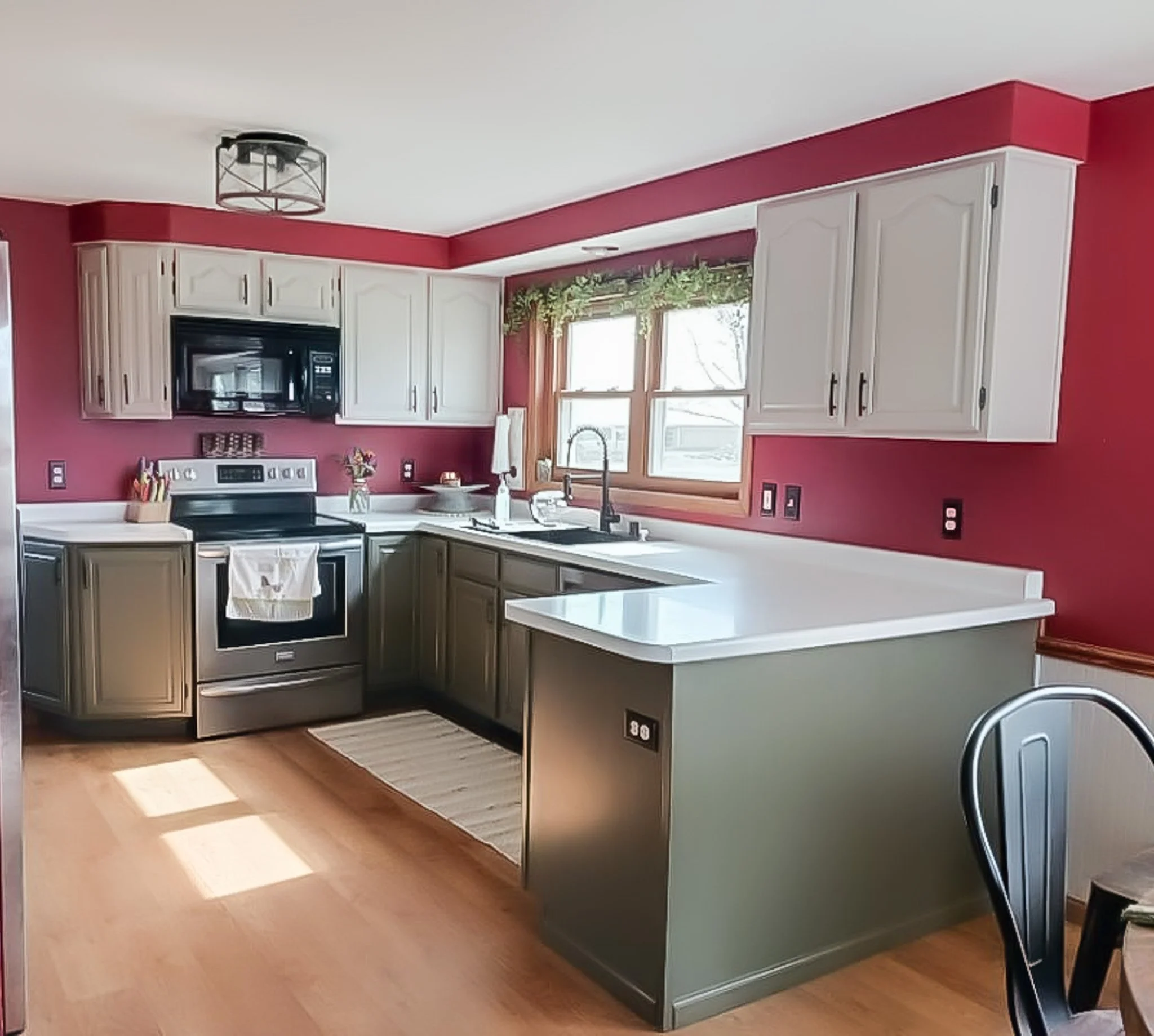 White and green painted cabinets by Barefoot Painter LLC in Thorp Wisconsin