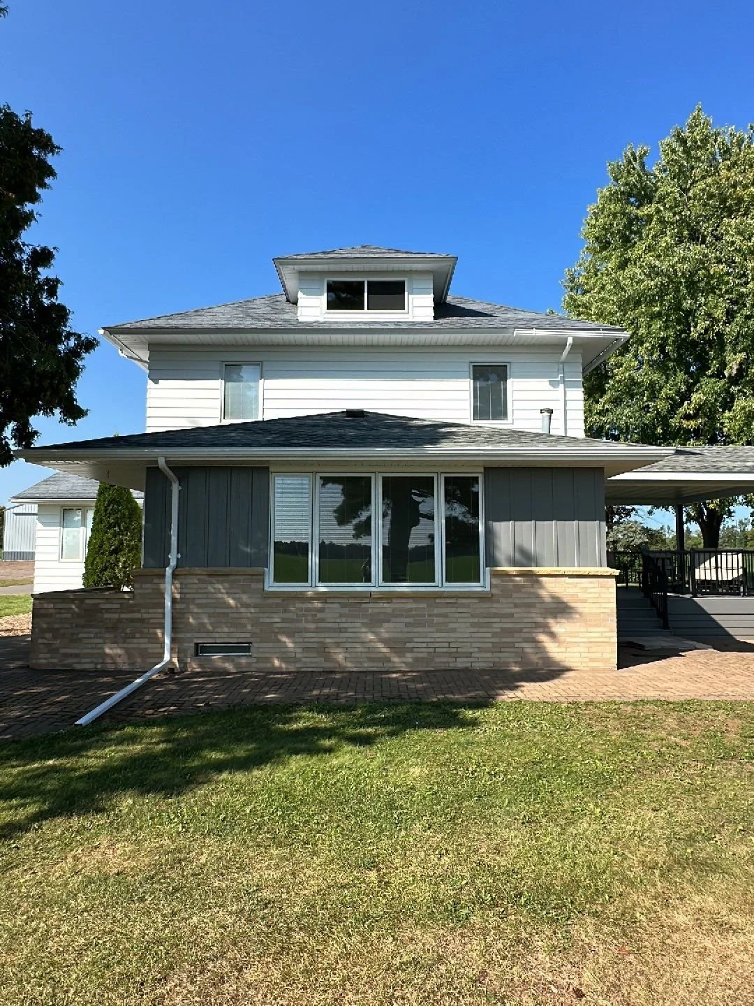 Farmhouse painting in Bruce Wisconsin located in Rusk County using white and gray
