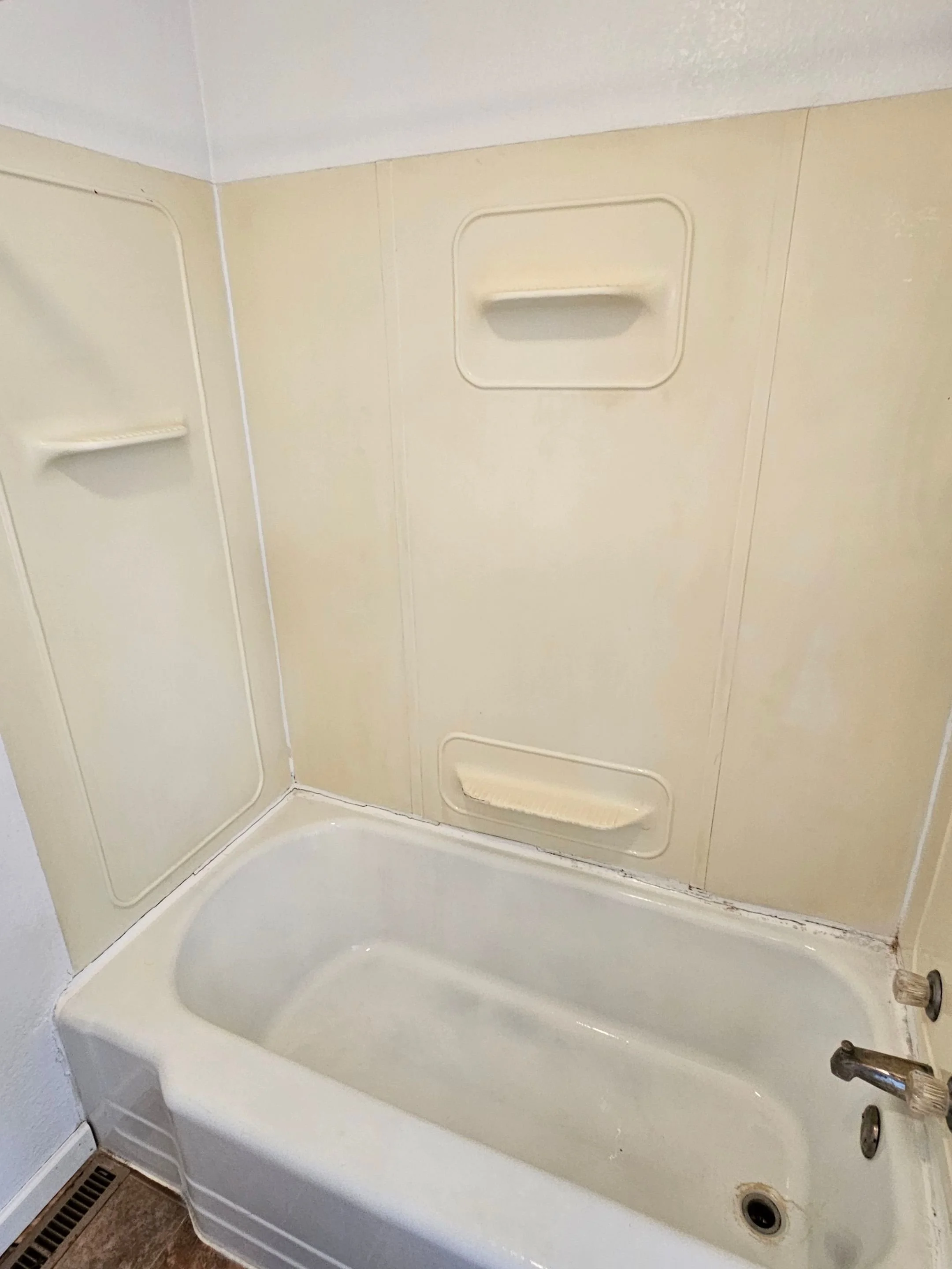 Tub and shower after cleaning by Barefoot Painter LLC