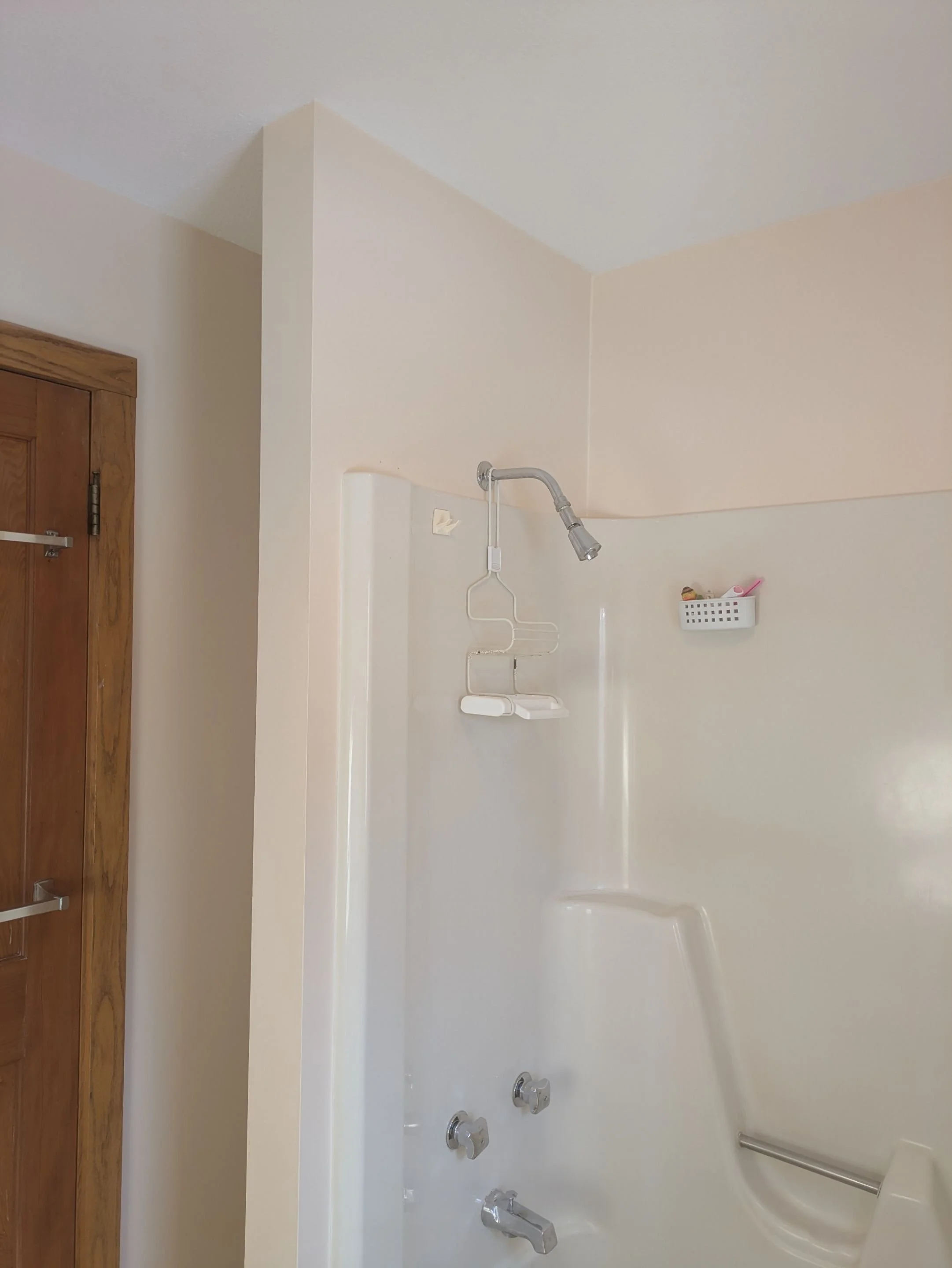 Fine lines with no sign of drywall repairs on bathroom shower area