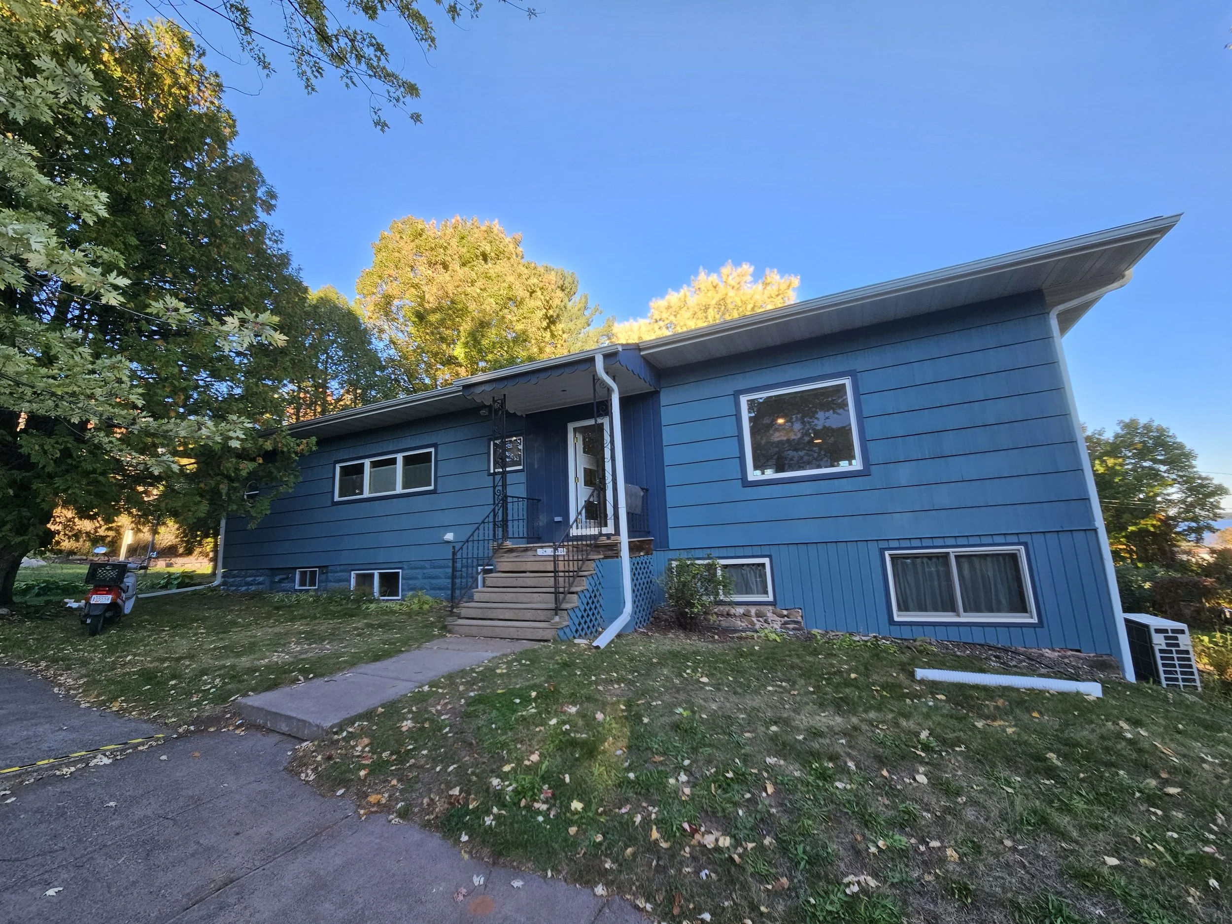 Multiple colors of blue and white were used on this home in Bayfield Wisconsin to give it a fresh new look