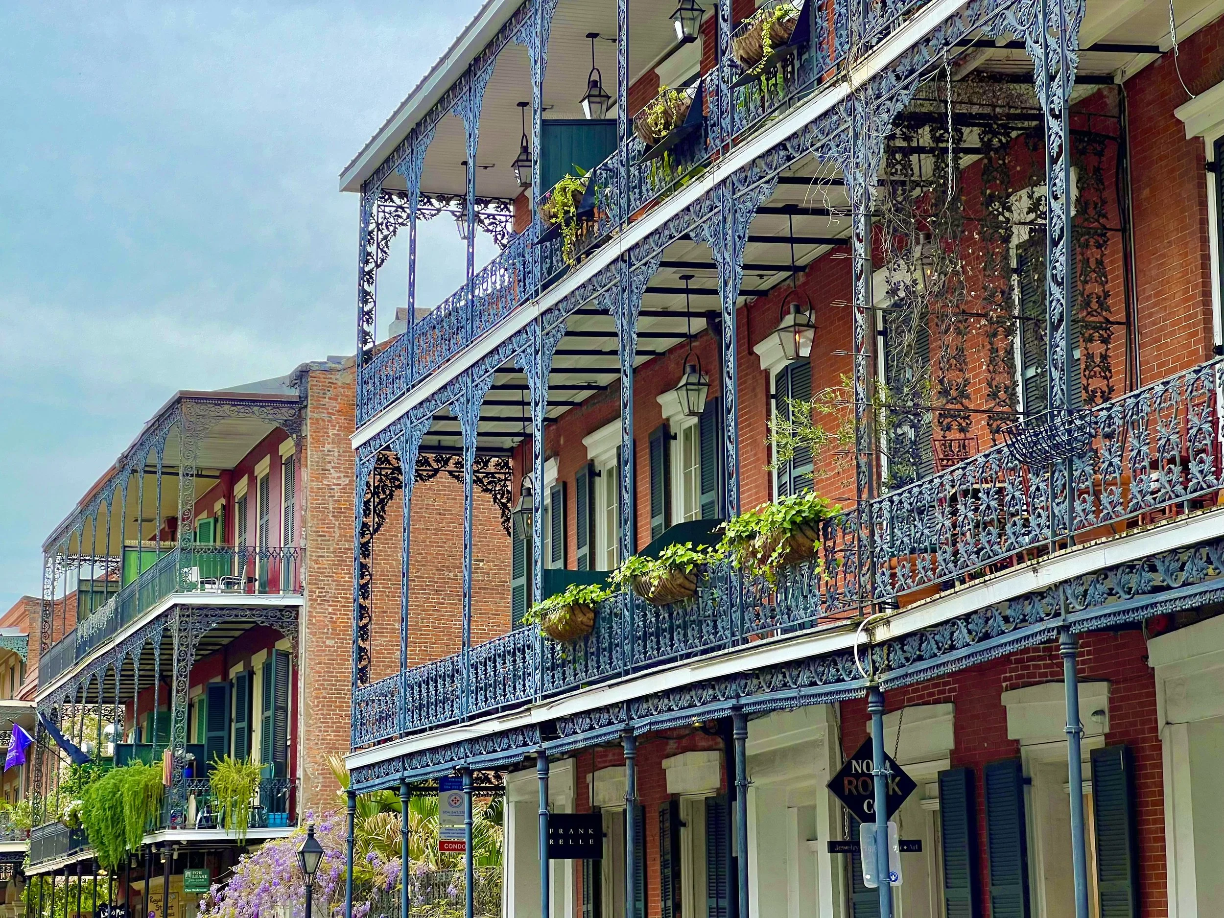 Historic New Orleans French Quarter balconies decorated for Mardi Gras.