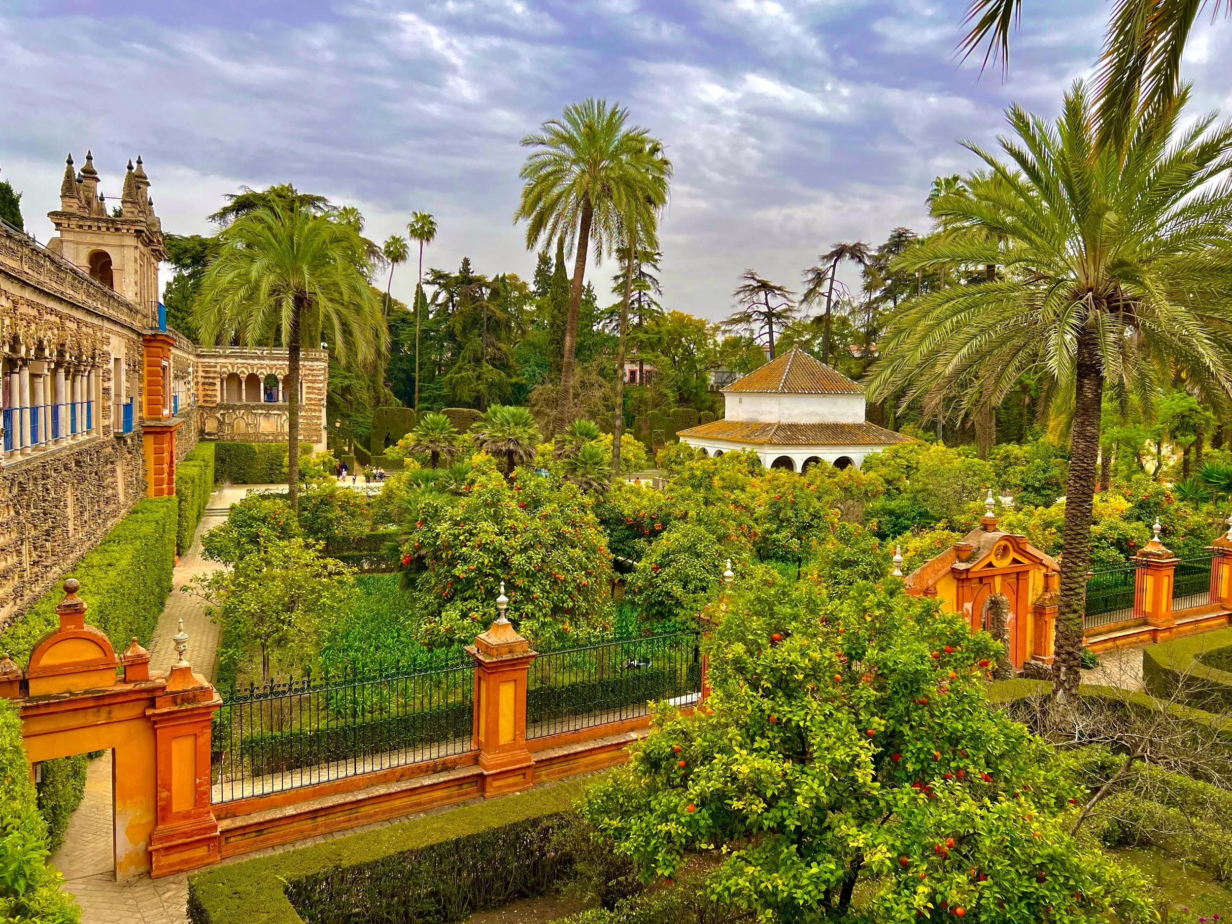 A lush garden view in the Real Alcazar in Seville, Spain.
