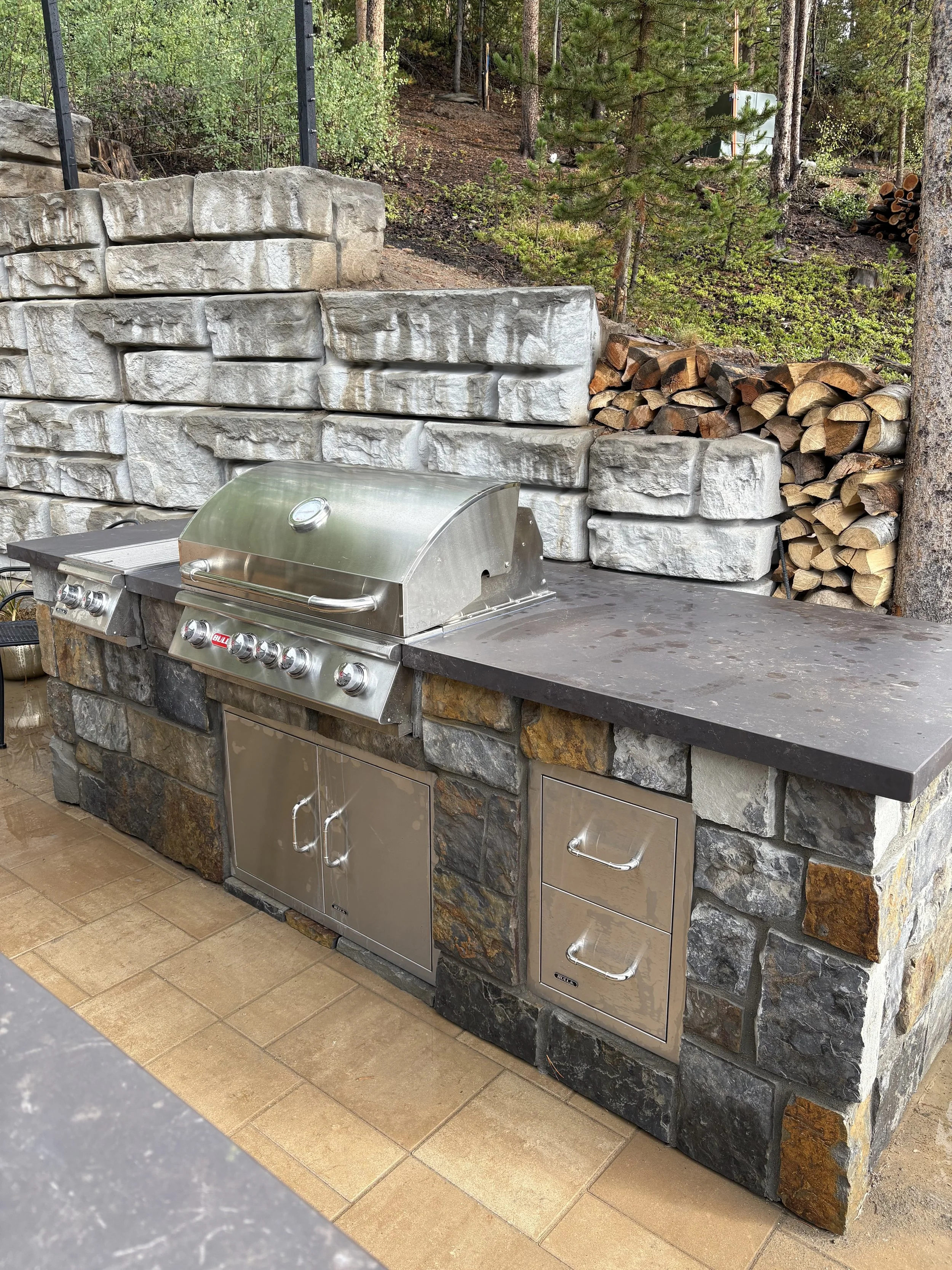 This outdoor kitchen was built using OLF (outdoor living foundation) base to build a more economical masonry based outdoor kitchen.