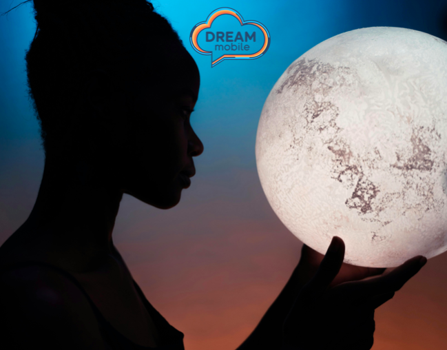 Silhouette of a person holding a glowing moon-like sphere, with a "DREAM mobile" logo in the sky.