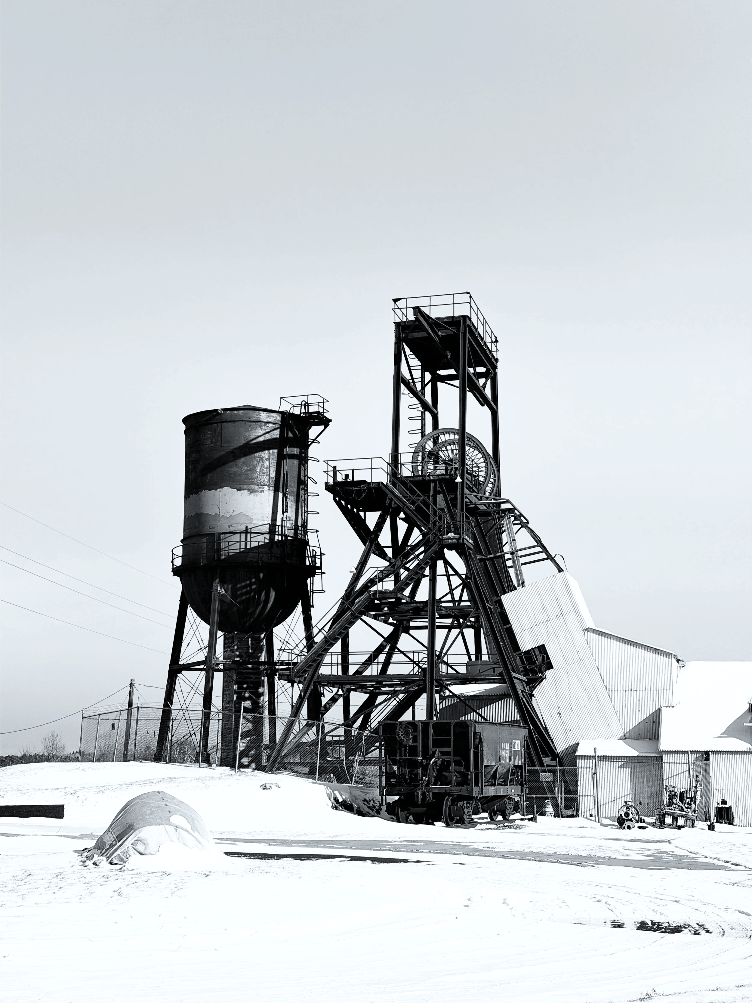 Metal water tower and head frame where the museum collection lives