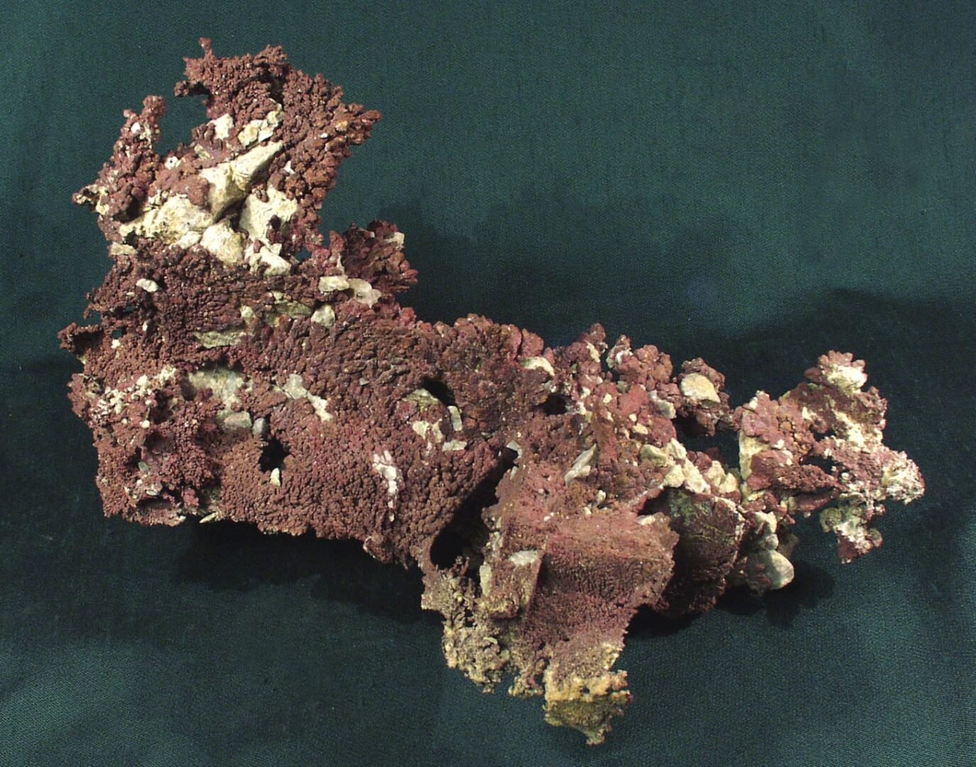 Native copper specimen with an irregular, branching form and a rough, reddish-brown surface.