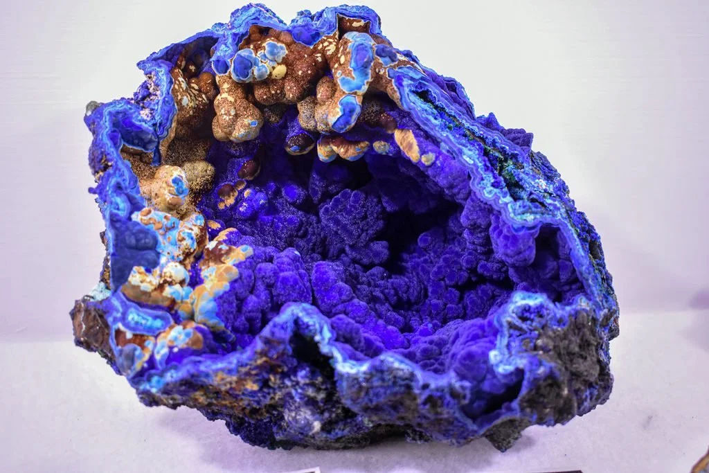 Botryoidal azurite specimen showing intense blue color and layered, rounded crystal textures.