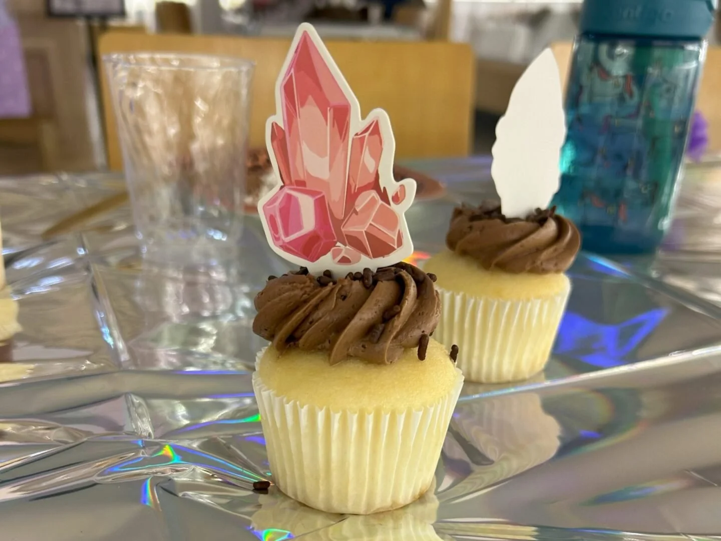 Chocolate cupcakes with crystal toppers.