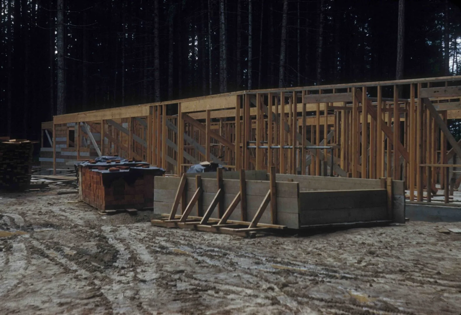 The upper walls of the original house have been framed out.