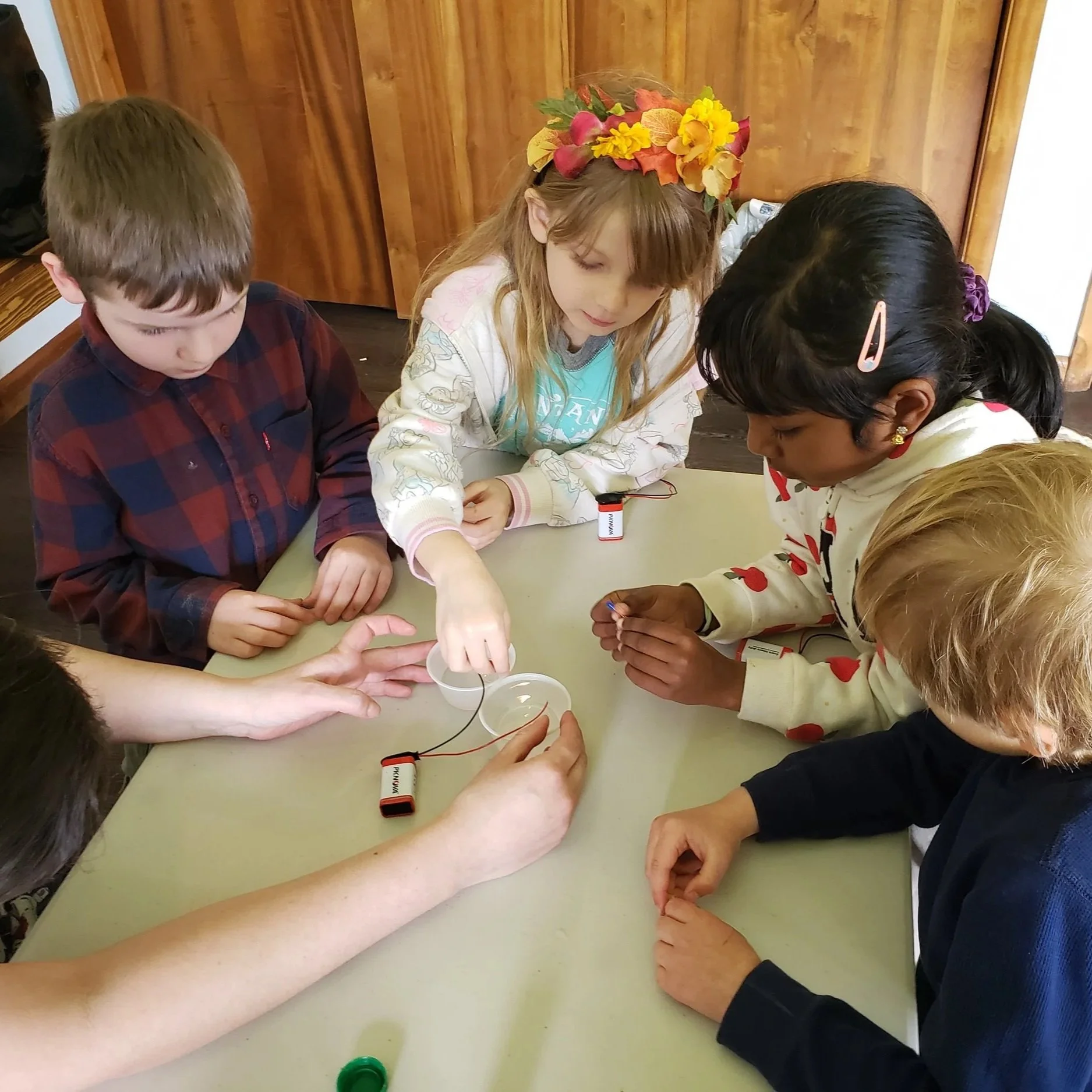 Kids working on a science experiment
