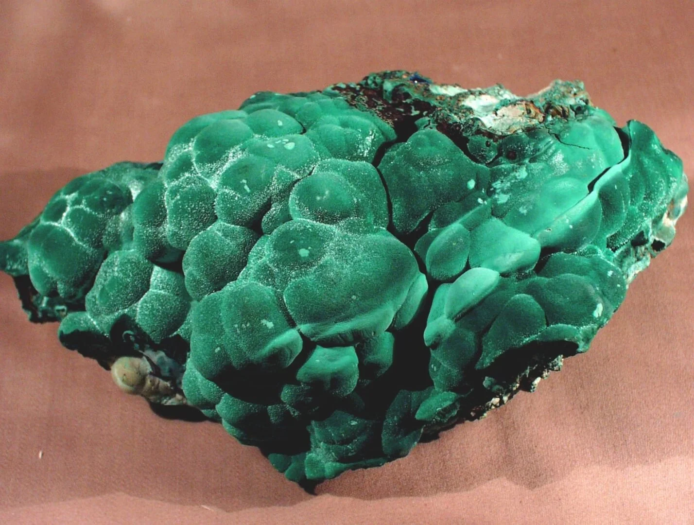 Botryoidal malachite specimen with rounded, bubble-like surface textures and deep green coloration.