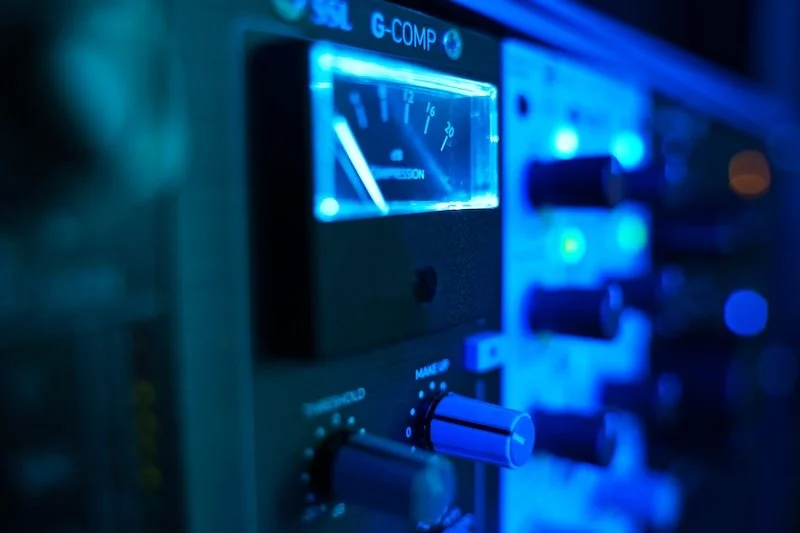 Analog recording gear SSL G-Comp in professional recording studio blue light